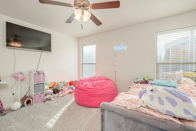 carpeted bedroom with ceiling fan