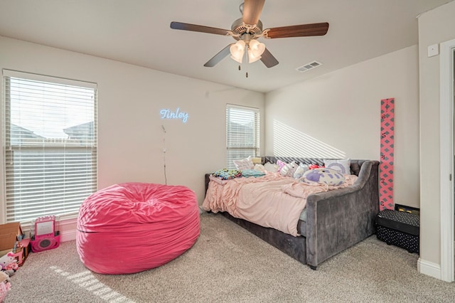 bedroom featuring carpet flooring, a ceiling fan, and visible vents