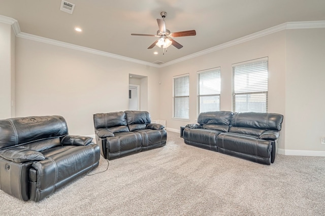 carpeted living area featuring crown molding, a ceiling fan, visible vents, and baseboards