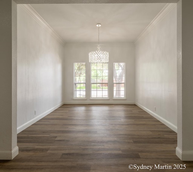 unfurnished dining area with dark wood finished floors, a chandelier, ornamental molding, and baseboards