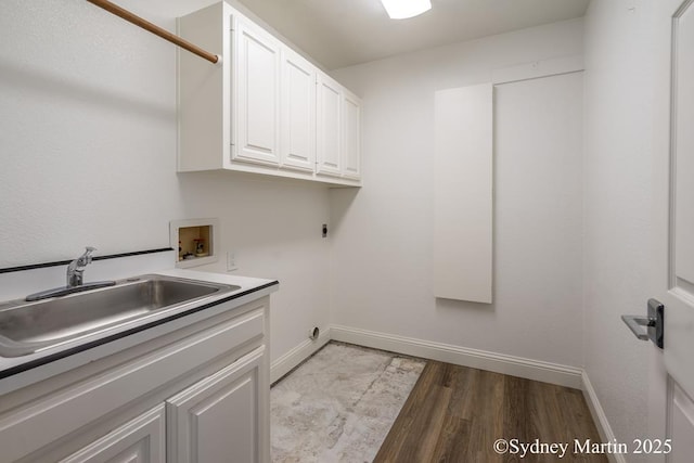 laundry room featuring cabinet space, washer hookup, electric dryer hookup, and baseboards
