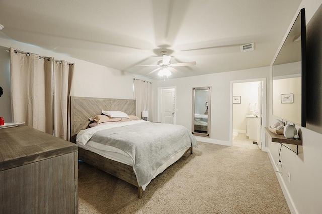 2623 E Ranch Ave, Midland, TX 79705 - bedroom with light colored carpet, a ceiling fan, and connected bathroom