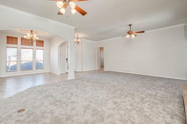 unfurnished living room with ceiling fan with notable chandelier, carpet, and ornamental molding