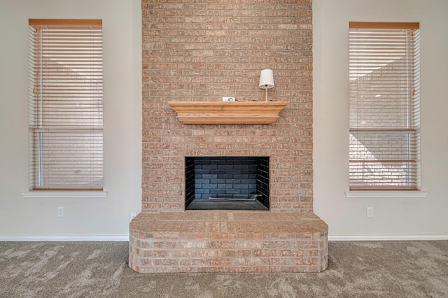 unfurnished living room featuring a fireplace and carpet floors