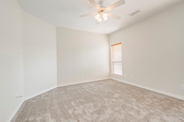 spare room with light carpet and ceiling fan