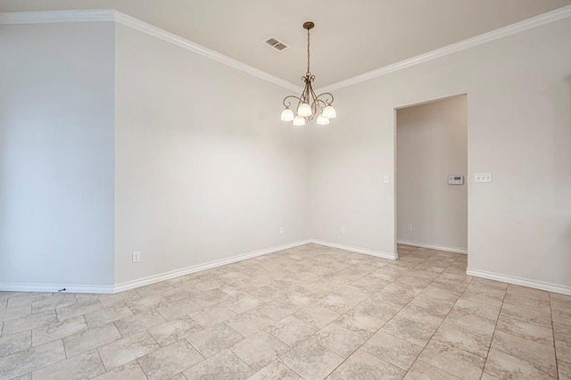 spare room featuring ornamental molding and an inviting chandelier