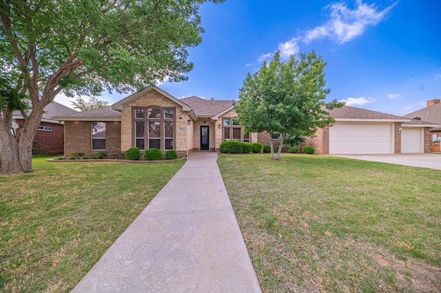 view of front of property featuring a garage and a front lawn