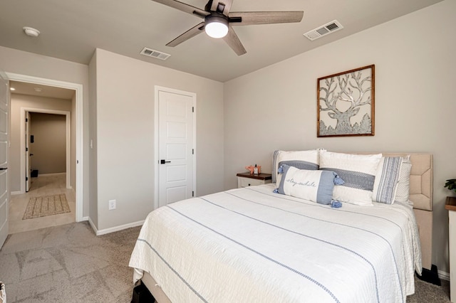 bedroom with carpet floors, baseboards, visible vents, and a ceiling fan