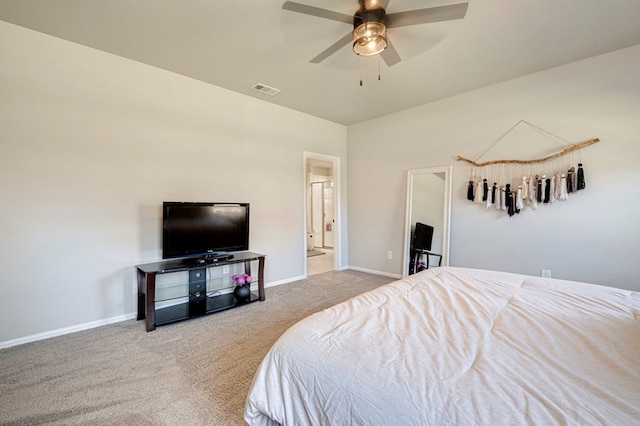 bedroom with ceiling fan, connected bathroom, visible vents, baseboards, and carpet