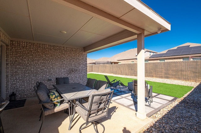 view of patio / terrace with outdoor dining space and a fenced backyard