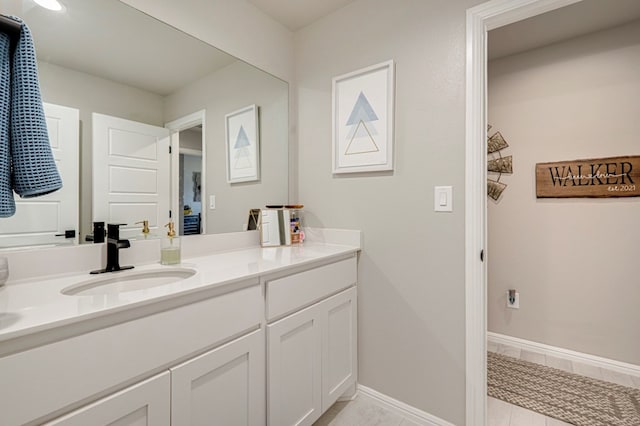 bathroom featuring vanity and baseboards