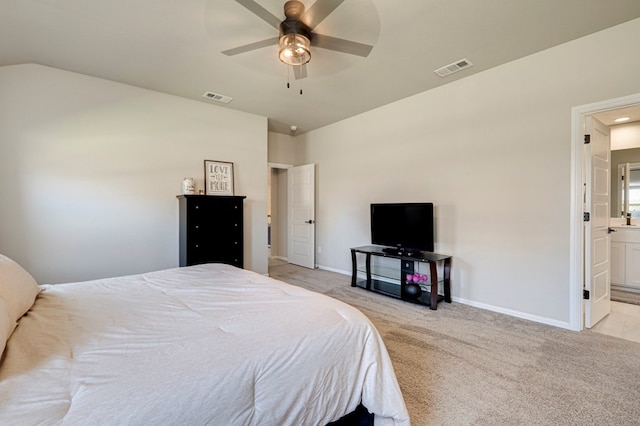 bedroom with light carpet, ceiling fan, visible vents, and baseboards