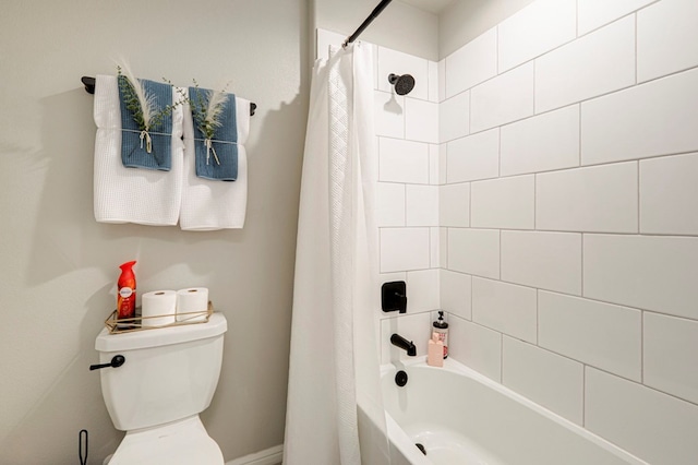 full bathroom with shower / tub combo and toilet