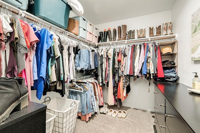 spacious closet with carpet floors