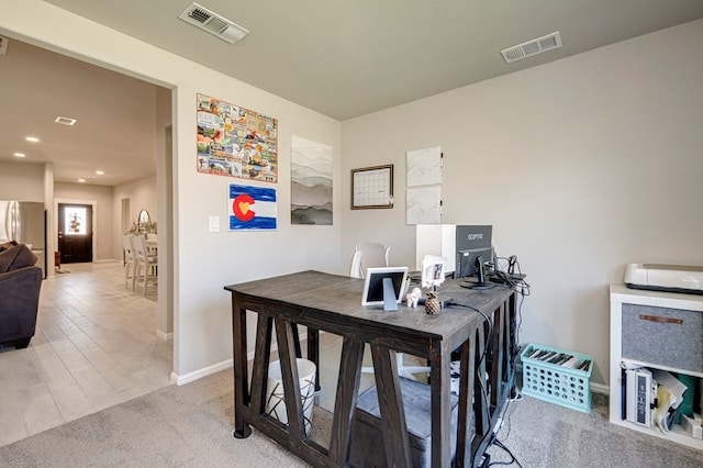 office space with recessed lighting, visible vents, light carpet, and baseboards