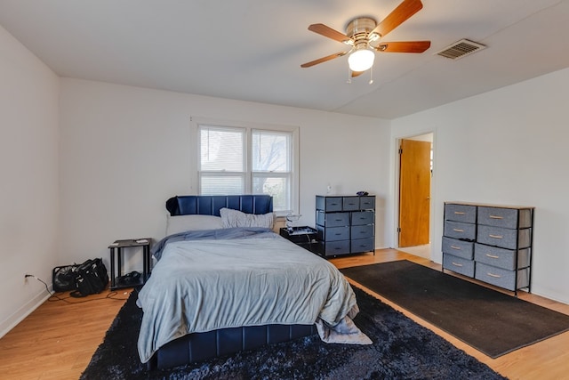 bedroom with ceiling fan and light hardwood / wood-style flooring