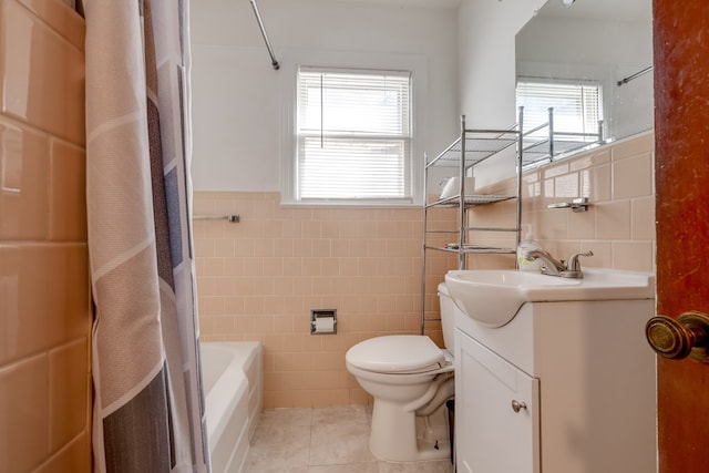 full bathroom featuring tile patterned floors, a healthy amount of sunlight, and tile walls