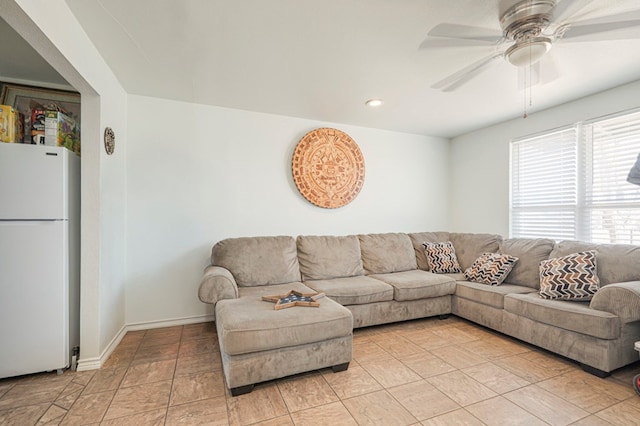 living room featuring a ceiling fan, recessed lighting, and baseboards