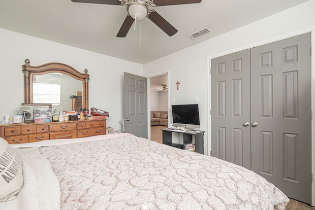 bedroom featuring a ceiling fan, a closet, and visible vents