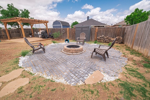 508 E Comiskey, Midland, TX 79706 - view of patio with a pergola, a fire pit, and a fenced backyard