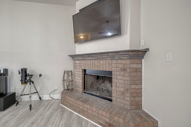 508 E Comiskey, Midland, TX 79706 - living room with wood finished floors, a brick fireplace, and baseboards