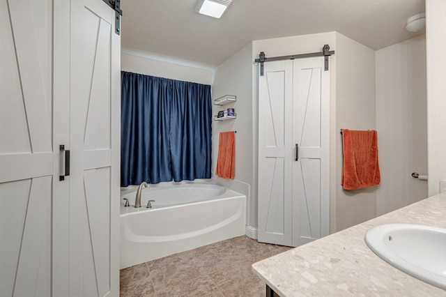 508 E Comiskey, Midland, TX 79706 - bathroom featuring a bath, vanity, and tile patterned flooring