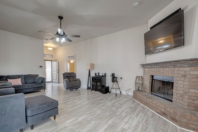 508 E Comiskey, Midland, TX 79706 - living area featuring ceiling fan, wood finished floors, and a fireplace