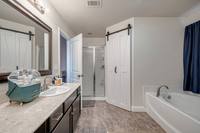 508 E Comiskey, Midland, TX 79706 - bathroom featuring a shower stall, vanity, a garden tub, and baseboards