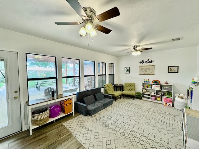 1303 Terra Ct, Midland, TX 79705 - living area with a ceiling fan and wood finished floors