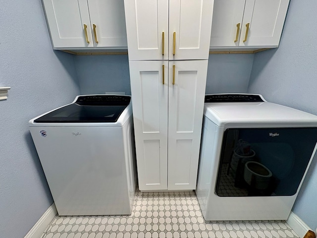 1303 Terra Ct, Midland, TX 79705 - washroom featuring cabinet space, separate washer and dryer, and light floors