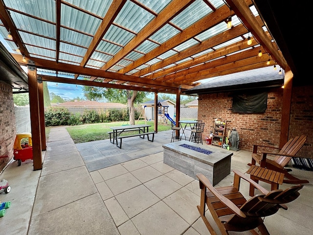 1303 Terra Ct, Midland, TX 79705 - fenced backyard with an outdoor fire pit, a storage unit, a patio area, and a pergola