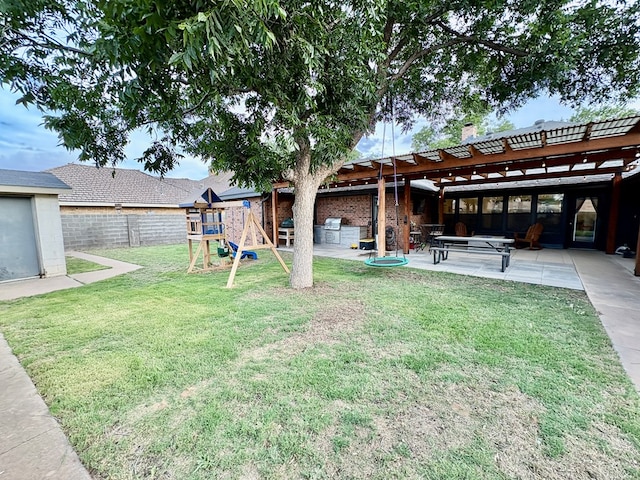 1303 Terra Ct, Midland, TX 79705 - fenced backyard with a playground, a patio area, and a pergola