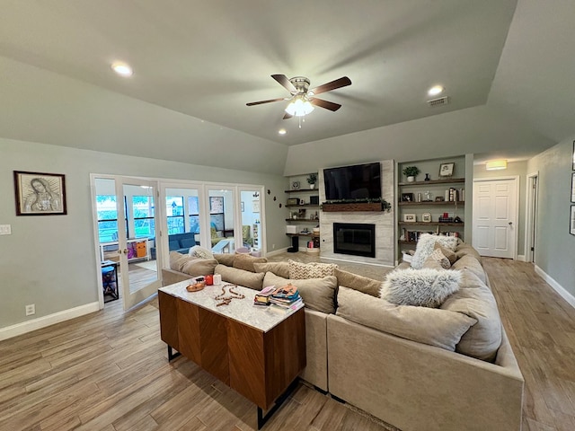 1303 Terra Ct, Midland, TX 79705 - living room with a ceiling fan, a high end fireplace, light wood-style flooring, lofted ceiling, and recessed lighting