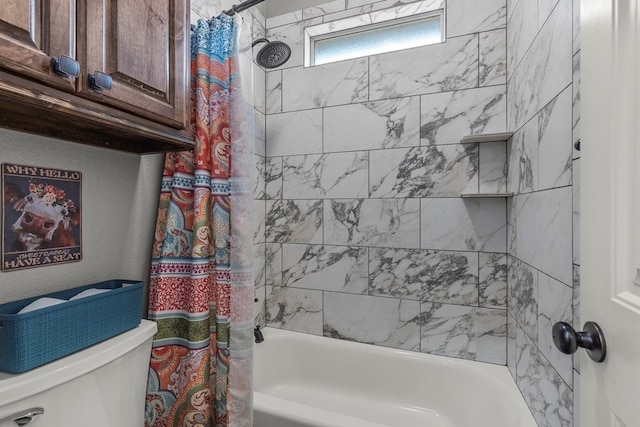 bathroom featuring shower / bath combo with shower curtain and toilet