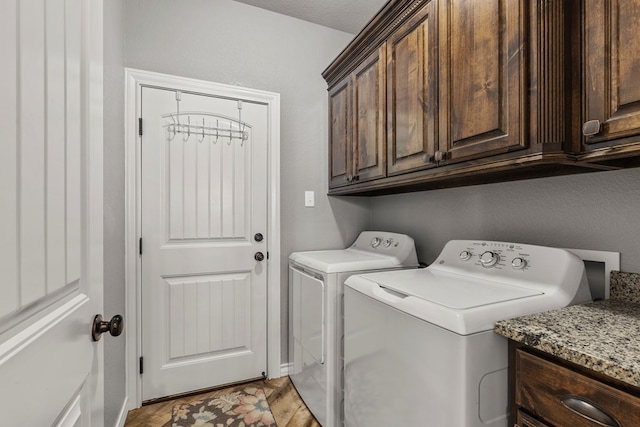 laundry area featuring cabinet space and washer and clothes dryer