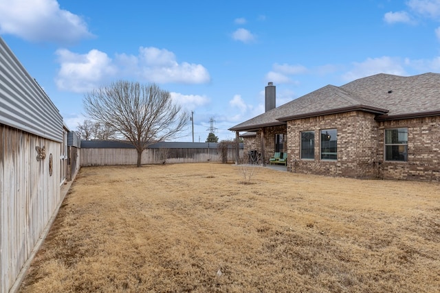 view of yard featuring a fenced backyard