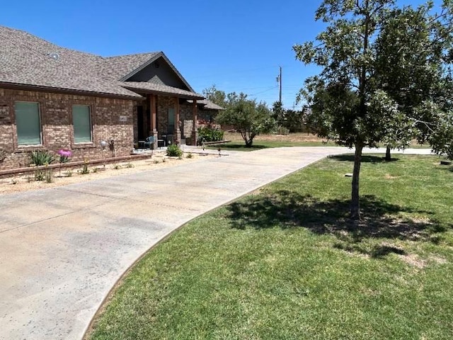 exterior space with concrete driveway