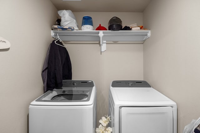 laundry room featuring washing machine and dryer