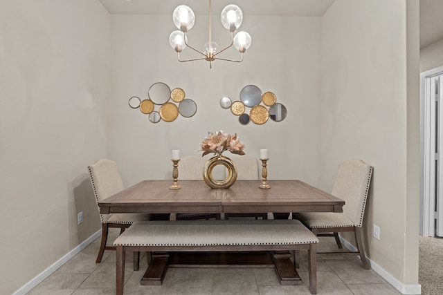 tiled dining space featuring a chandelier