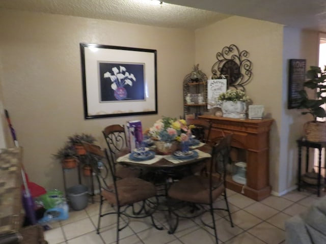 4700 Boulder Ave Unit 611, Midland, TX 79707 - tiled dining space with a textured ceiling