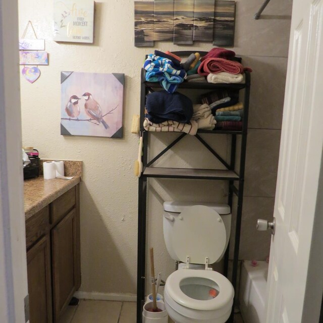 4700 Boulder Ave Unit 611, Midland, TX 79707 - full bathroom featuring vanity, tile patterned flooring, toilet, a bathtub, and a shower