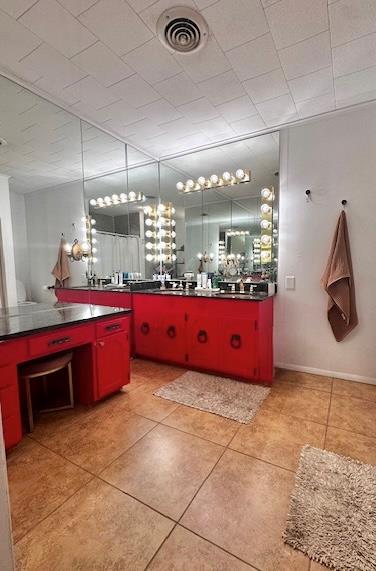 bathroom featuring vanity and tile patterned flooring