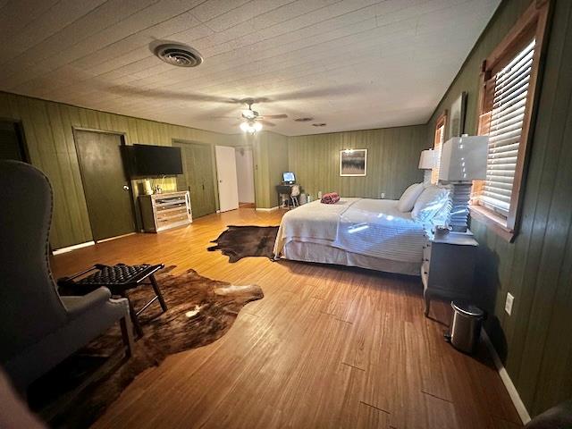 bedroom featuring ceiling fan and light wood-type flooring