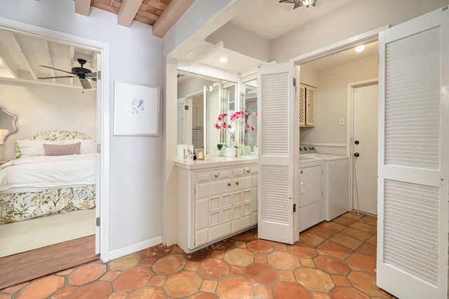 bathroom with ceiling fan, beam ceiling, and washing machine and dryer