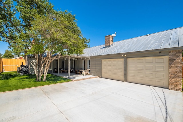 view of front facade featuring a front yard and a patio area