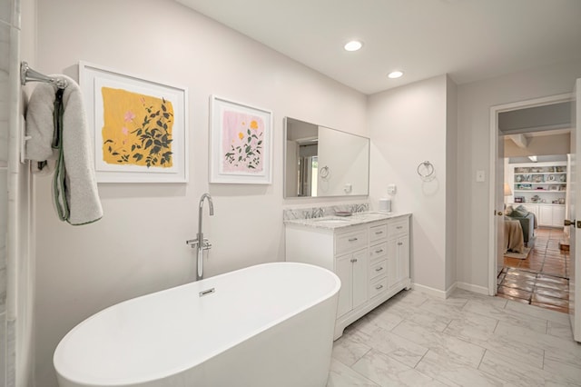 bathroom with a bathtub and vanity