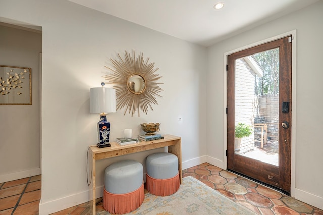 foyer entrance featuring light tile patterned floors