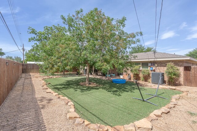 1505 Alcove Ct, Midland, TX 79703 - view of yard featuring central air condition unit