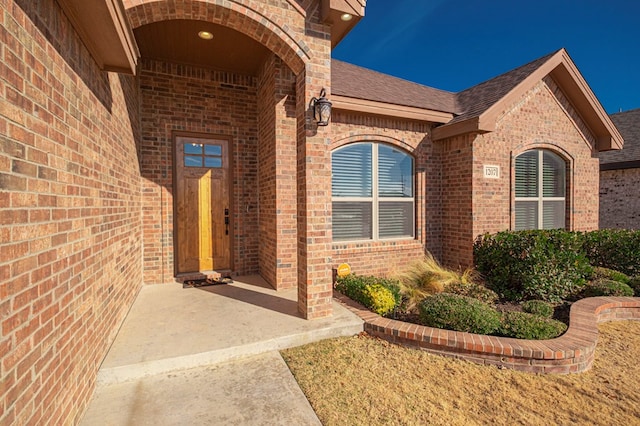 property entrance with a patio area