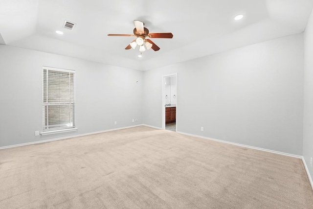 4910 Rio Grande Ave, Midland, TX 79707 - empty room featuring a raised ceiling, a ceiling fan, light carpet, and recessed lighting